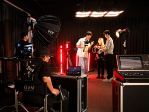 Photographer working hard with lighting kit
