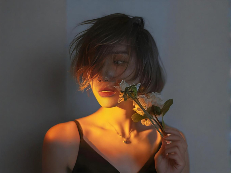 Model's hair highlighted by an LED studio light for portrait separation